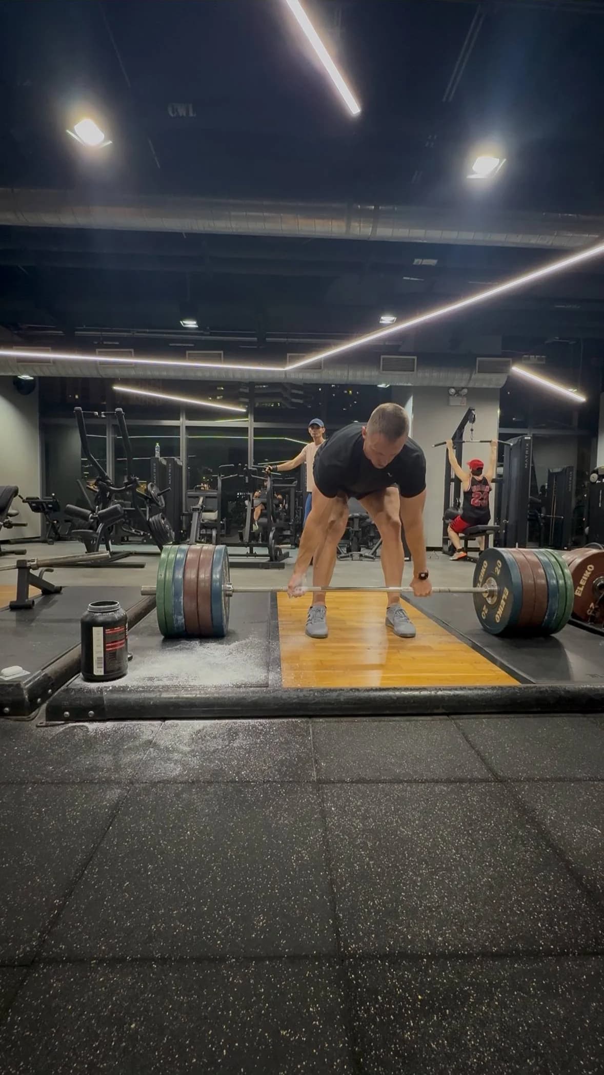 Spencer Tarring training with a loaded barbell in the gym